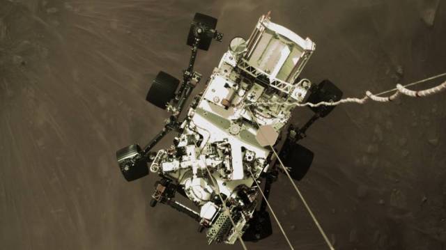 The Mars Perseverance Rover descending from its skycrane.